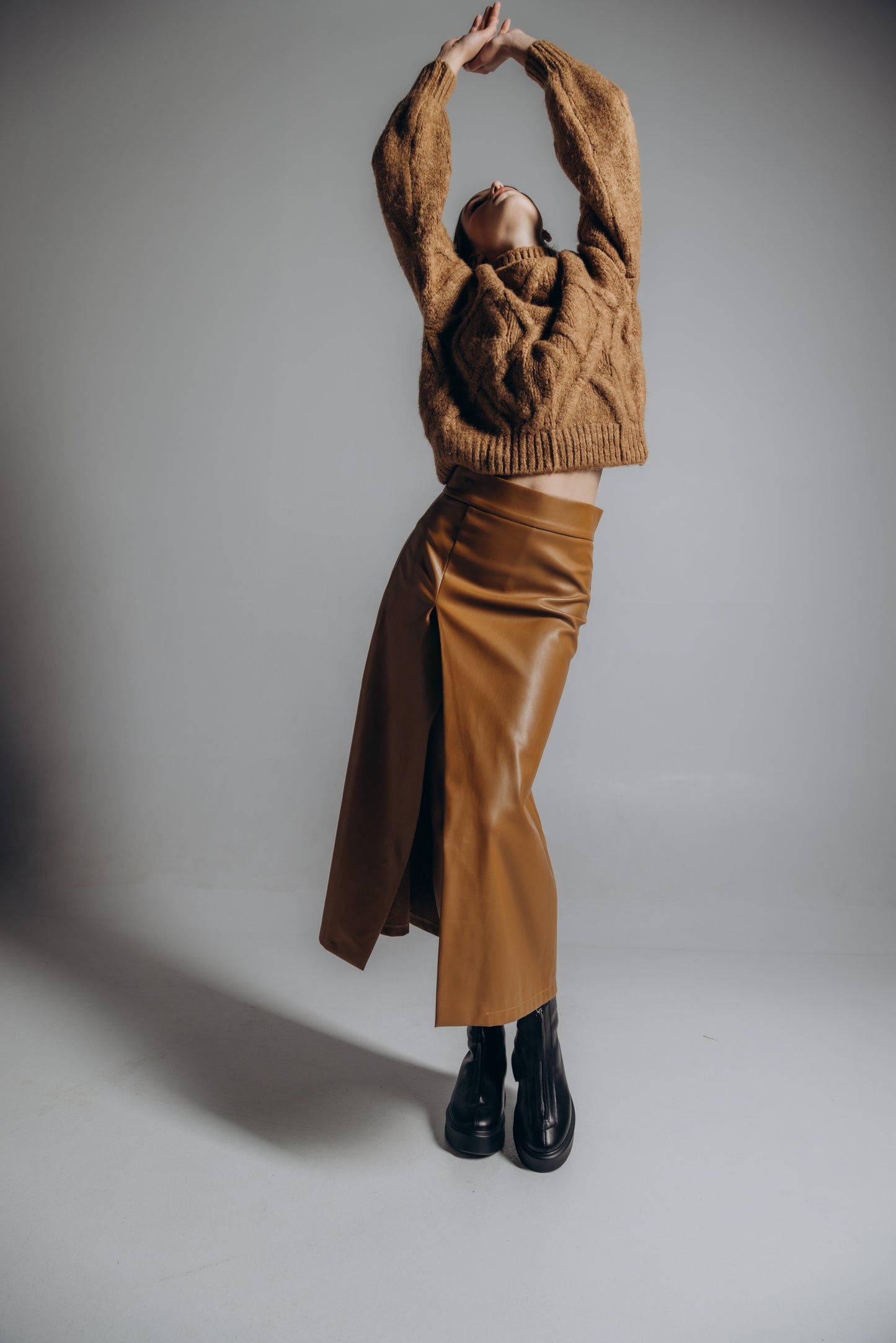 Eco leather midi skirt with slit